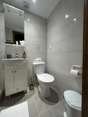 a bathroom with a toilet and a sink at Zoe House-Old Town in Rhodes Town
