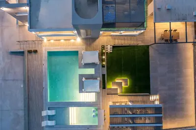 an overhead view of a building with a swimming pool at Grand Aqua Luxury Villa by Mintzi in Yennadhion