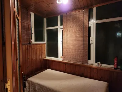 a room with a bed in a room with windows at House ROSI in Rodos city in Rhodes Town