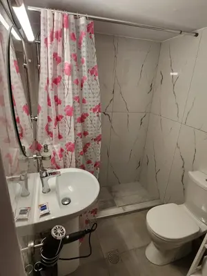 a bathroom with a sink and a toilet and a shower at House ROSI in Rodos city in Rhodes Town