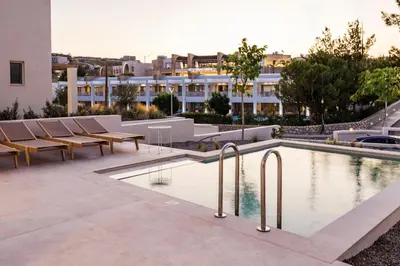 a swimming pool on the roof of a building at 3 Villa Complex in Kiotari