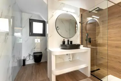 a bathroom with a sink and a mirror at Villa Hodaj in Afantou
