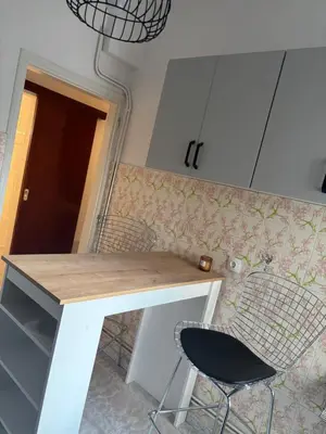 a kitchen with a desk and a chair in a room at Rosi Rhodos in Rhodes Town
