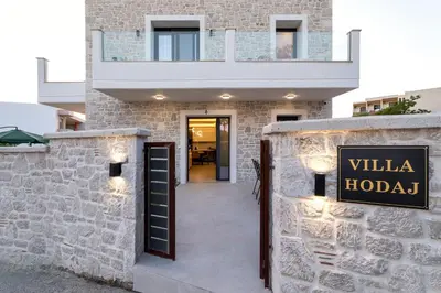 a building with a sign that reads willka hotel at Villa Hodaj 2 in Afantou