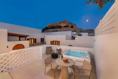 a villa with a swimming pool and a patio at Kantouni Lindos ELEGANT APARTMENT in Líndos