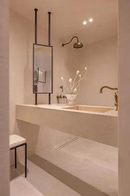 a bathroom with a tub and a sink and a mirror at Kantouni Lindos ELEGANT APARTMENT in Líndos