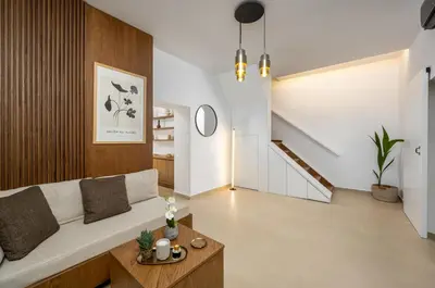 a living room with a couch and a table at Aroha Apartments in Rhodes Town