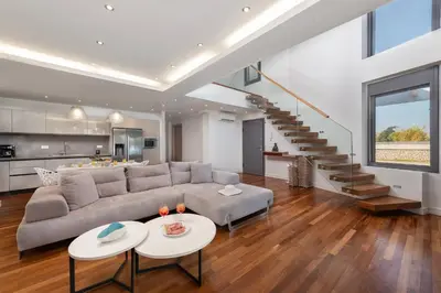 a living room with a couch and a table at Kiotari Dream beachfront villa in Gennadi