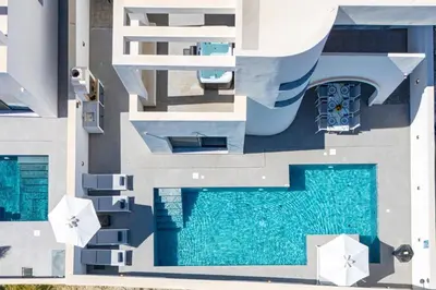 an aerial view of a building with a swimming pool at Villa Askim Evelia by Villa Plus in Ialyssos