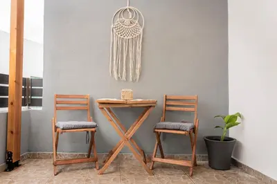 a table and two chairs next to a table at Luxury Getaway with Jacuzzi - Platanos House Salakos in Sálakos