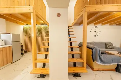 a small apartment with a loft bed and a kitchen at Luxury Getaway with Jacuzzi - Platanos House Salakos in Sálakos