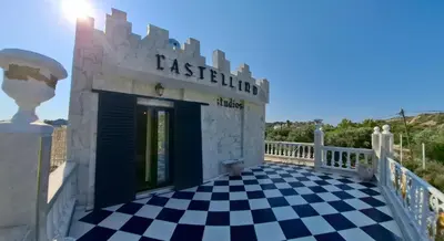 a building with a black and white checkered floor at Castellino Studios in Faliraki