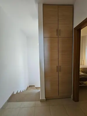 a room with a closet with wooden cabinets at Villa Mare in Kiotari