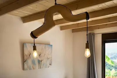 a couple of lights hanging from a ceiling at Valley View Studio Apartment Salakos in Sálakos