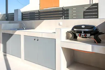 a kitchen with a grill sitting on a counter at Kiki Luxury Villa in Afantou