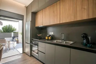 a kitchen with a sink and a counter top at Kiki Luxury Villa in Afantou