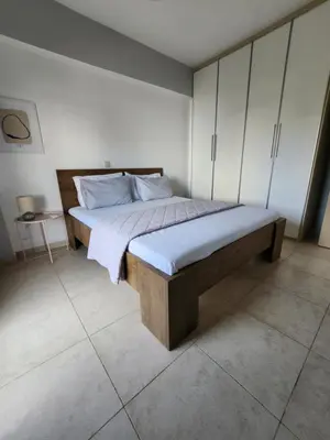 a bedroom with a large bed in a room at Grande casa di Ialysos in Ixia