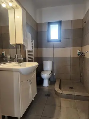 a bathroom with a sink and a toilet and a window at Grande casa di Ialysos in Ixia