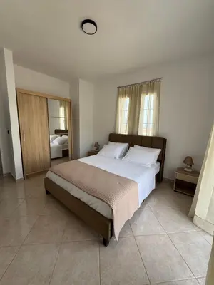 a bedroom with a large bed in a room at Jojo's Home in Kamiros