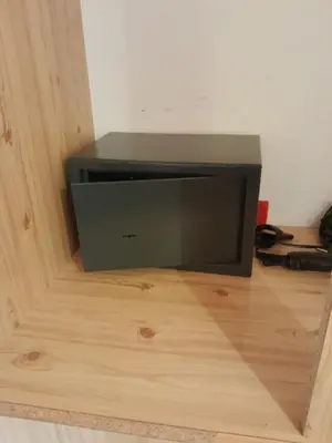 a television sitting on top of a wooden floor at Sevasti Symi Studios in Symi