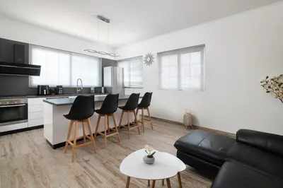 a living room with a couch and a table at Sun Dream Apartment in Rhodes Town