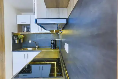 a kitchen with a sink and a counter top at Modern near the sea-Sunset View Apartments in Ixia