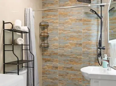 a bathroom with a shower and a toilet and a sink at VaStekaHouse in Haraki