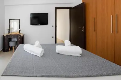 a bedroom with two white pillows on a bed at Calm and Joy Summer House in Afantou