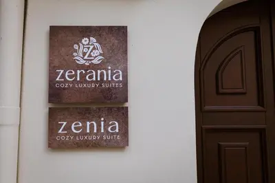 a sign on the side of a building next to a door at Zerania Suites in Rhodes Town