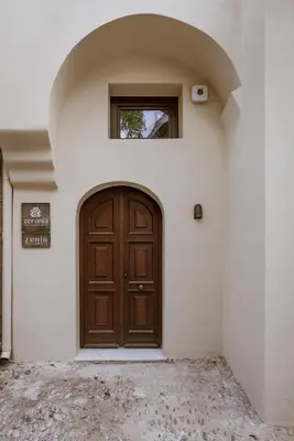 a wooden door on the side of a building at Zerania Suites in Rhodes Town