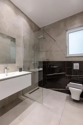 a bathroom with a tub and a sink and a toilet at Micasa Suite Rhodos in Rhodes Town
