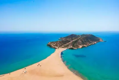 an island in the ocean with people on a beach at Villa Apollo Classico in Kolimbia