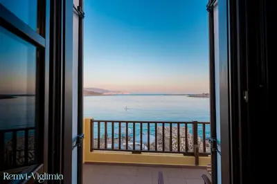 a view of the ocean from a balcony at Remvi Seaside Houses in Halki