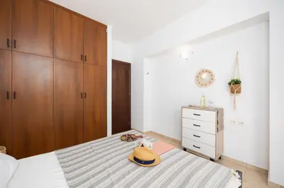 a bedroom with a bed with a purse on it at Villa Maia in Phanaes
