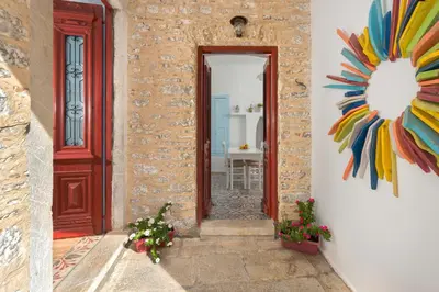 a door to a room with a painting on the wall at Castello Venetsiana in Symi