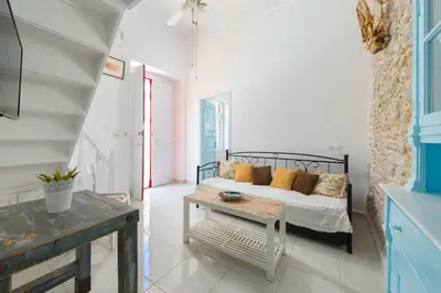 a living room with a couch and a table at Castello Venetsiana in Symi