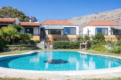 a swimming pool in front of a house at Villa Seashell in Pefki Rhodes