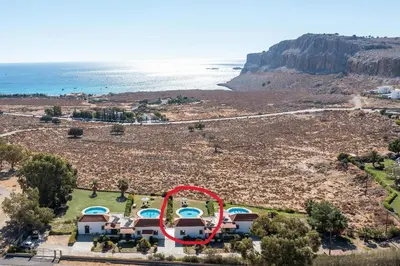 an aerial view of a resort with a red circle at Villa Seashell in Pefki Rhodes