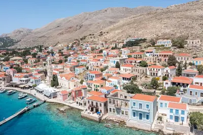 an aerial view of a town next to the water at Isminis Villa in Halki