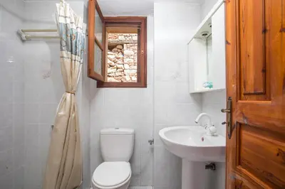a bathroom with a toilet and a sink at Isminis Villa in Halki