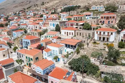 an aerial view of a town with colorful houses at Isminis Villa in Halki
