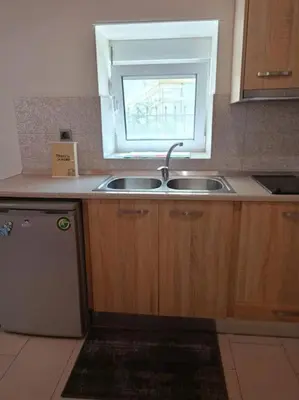 a kitchen with a sink and a window at Sunnyside Apartment in Rhodes Town