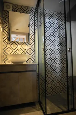 a bathroom with a sink and a mirror at Diolanth traditional house in Koskinou