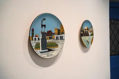 two plates on a wall with a giraffe on it at Diolanth traditional house in Koskinou