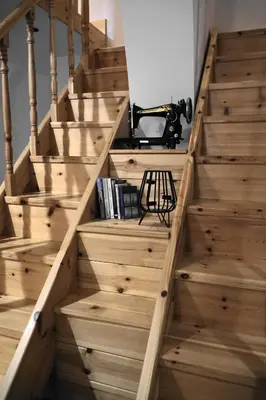 a stairwell with wooden steps with a camera on it at Diolanth traditional house in Koskinou