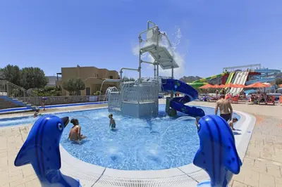 a group of people playing in a water park at Villa Daphne in Kalathos