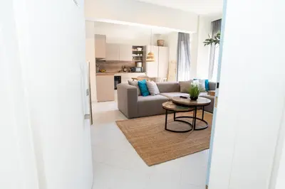 a living room with a couch and a table at FeWo Traum auf Rhodos in Rhodes Town