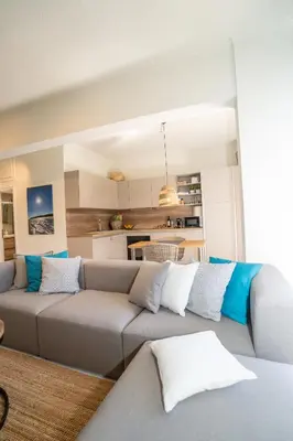a living room with two couches and a kitchen at FeWo Traum auf Rhodos in Rhodes Town