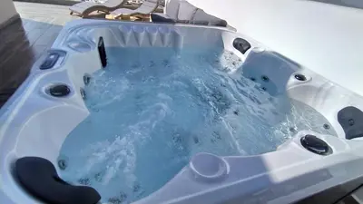 a bath tub with blue water in it at Rustic House Smaro in Émbonas