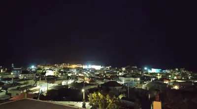 a view of a city at night with lights at Rustic House Smaro in Émbonas
